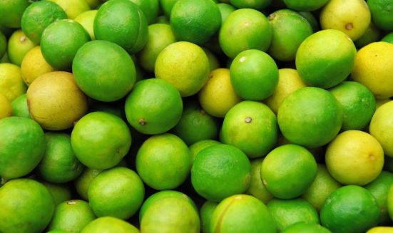 Close up fresh juicy limes on pile