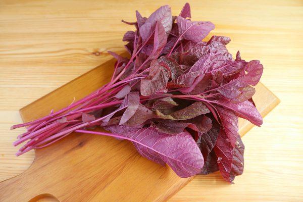 fresh-organic-red-spinach-amaranthus-dubius-wooden-chopping-board